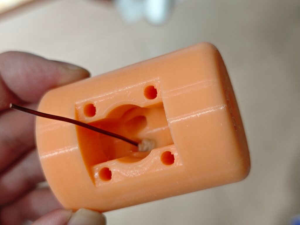 the antenna base, implanted banana jack with a short piece of enamel wire, front view