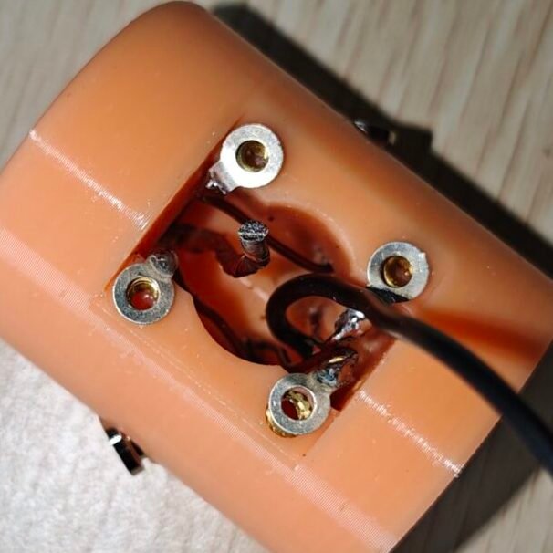 the antenna base, two inner wires for connecting to a so239 connector, central conductor and ground