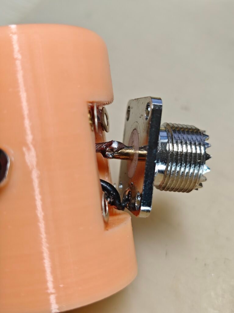 the base of the vertical, closed-up view, mounting the so239 connector