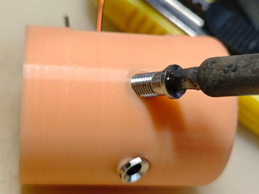 the antenna base, use a solder iron to heat the banana jack and push it into the 3d printed antenna base