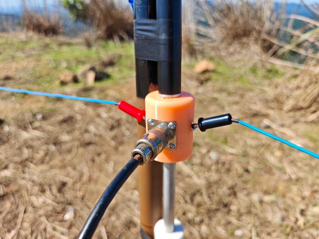 base of the vertical, feed point and radial connection