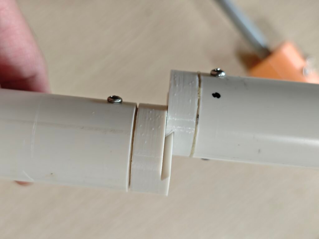 two pieces of pvc tubes and 3d printed parts used as the ground stake for supporting the antenna
