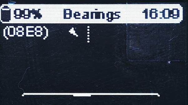 Meshtastic node OLED bearing screen with node ID and direction indicator