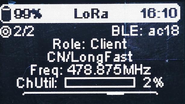 Meshtastic node OLED screen showing LoRa parameters: frequency, mode, role, and BLE connection