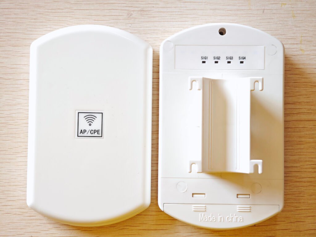 Front and back exterior view of white AP/CPE waterproof outdoor electronics enclosure, with Wi-Fi logo, SIG signal ports and mounting bracket