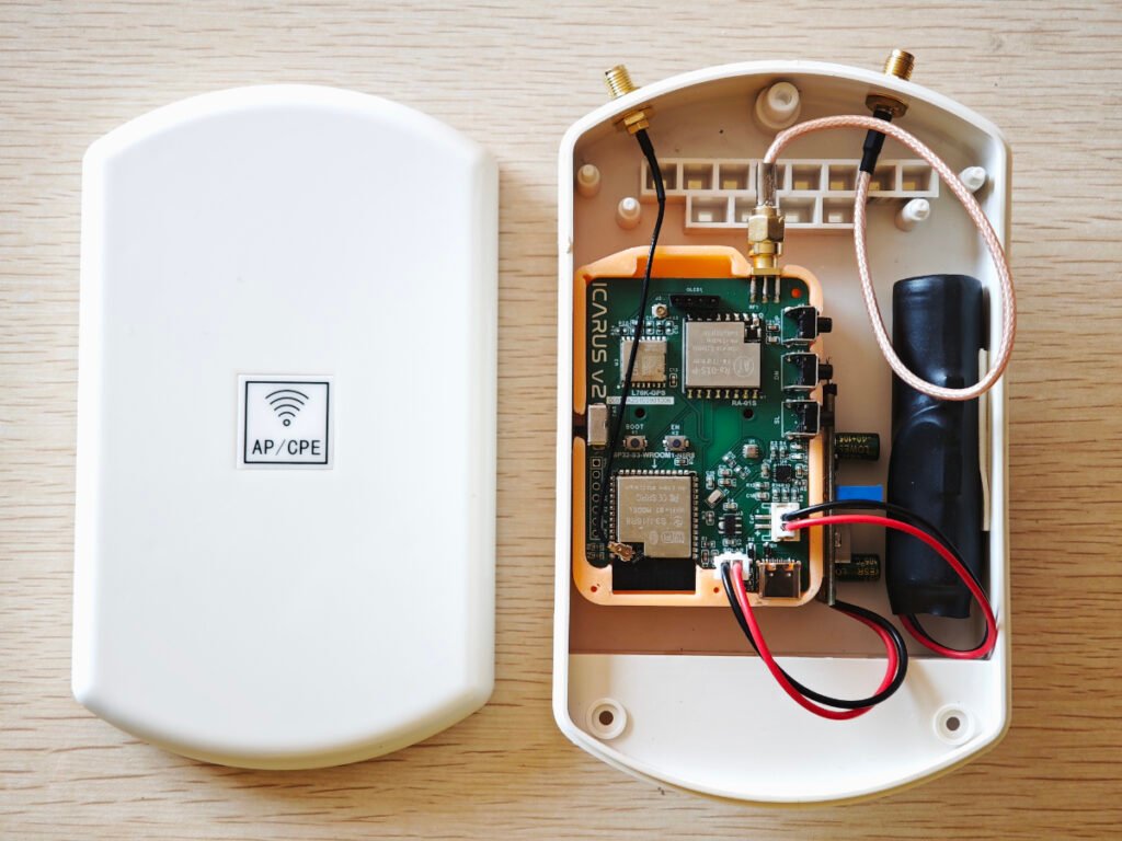 ICARUS V2 Meshtastic board with OLED, RA‑01S LoRa module inside AP/CPE case