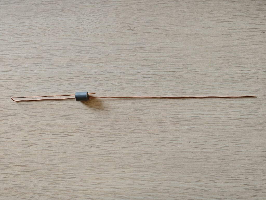 Copper J-Pole antenna wire with spacer installed before final assembly