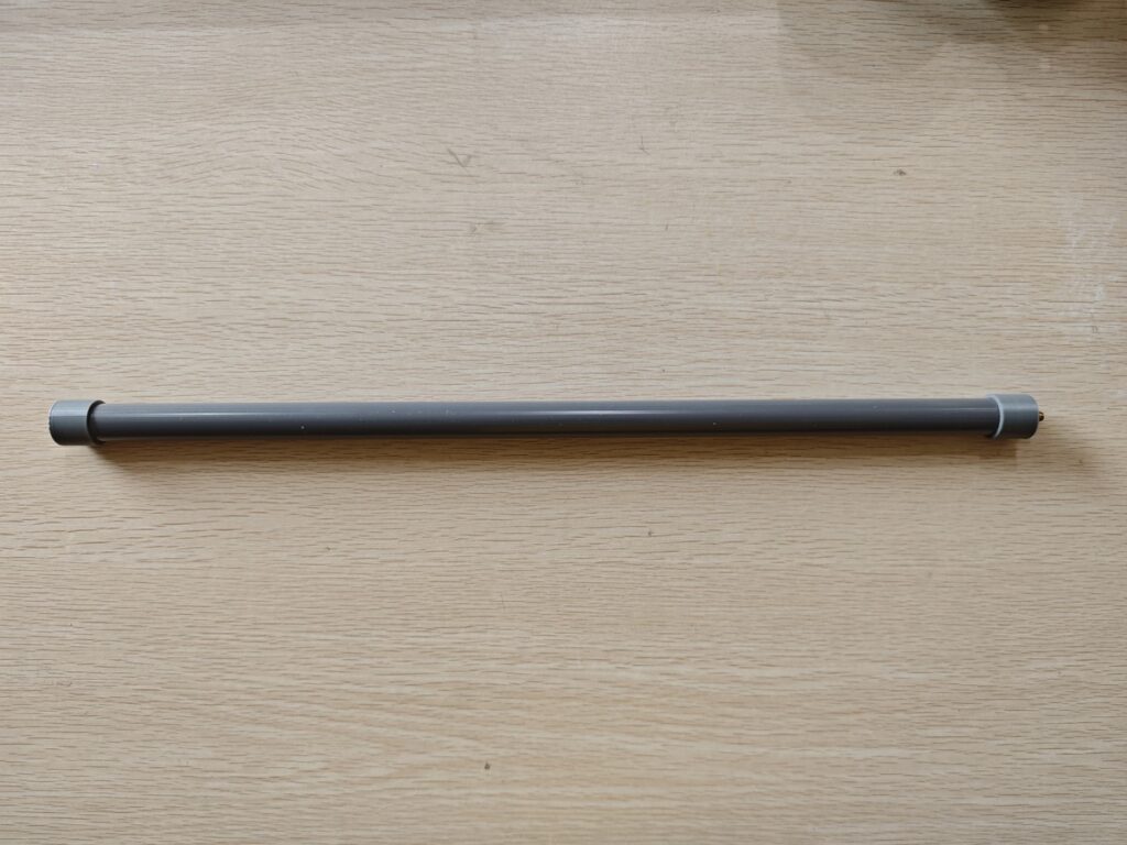 Finished homemade J-Pole antenna enclosed in gray PVC pipe for waterproofing