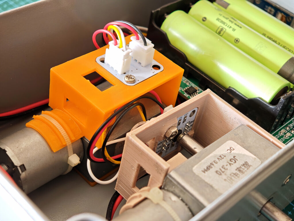 Close-up of JGY-370 motor and AS5600 magnetic encoder mounted on a custom 3D-printed bracket inside the antenna rotator
