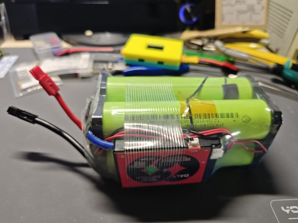 4S LiFePO4 battery pack with green cells, BMS board, balance wiring, and power leads.