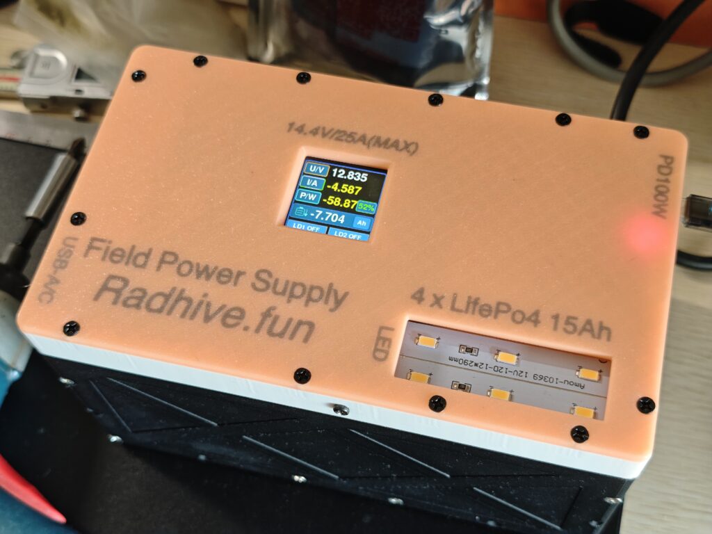 Finished field power supply enclosure with a small color battery meter display on the top cover.