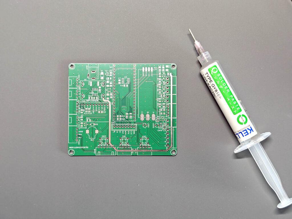 PlantLab PCB beside a solder paste syringe before SMD assembly