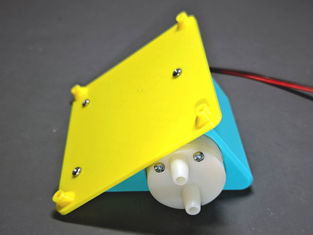 PlantLab yellow rear shell fastened to light green stand with self-tapping screws